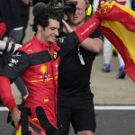 
              Ferrari driver Carlos Sainz of Spain celebrates after winning the British Formula One Grand Prix at the Silverstone circuit, in Silverstone, England, Sunday, July 3, 2022. (AP Photo/Matt Dunham)
            