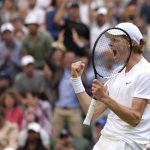 
              Italy's Jannik Sinner celebrates defeating Spain's Carlos Alcaraz during a men's fourth round singles match on day seven of the Wimbledon tennis championships in London, Sunday, July 3, 2022.(AP Photo/Kirsty Wigglesworth)
            