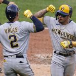 
              Milwaukee Brewers' Kolten Wong, right, celebrates with Luis Urias after hitting a solo home run off Pittsburgh Pirates relief pitcher Chase De Jong during the eighth inning of a baseball game in Pittsburgh, Saturday, July 2, 2022. (AP Photo/Gene J. Puskar)
            
