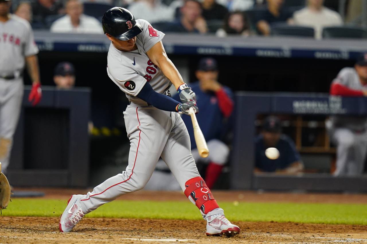 Boston Red Sox's Rob Refsnyder hits a single during the fifth inning of the team's baseball game ag...