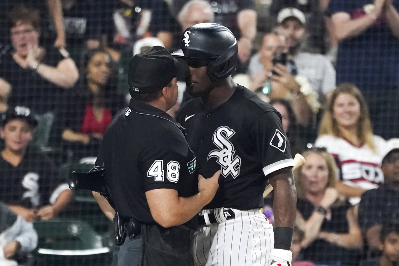 Chicago White Sox's Tim Anderson, right, gets in the face of home plate umpire Nick Mahrley after A...