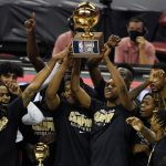 
              FILE - Sacramento Kings players hold up the trophy after defeating the Boston Celtics in the NBA summer league championship basketball game Tuesday, Aug. 17, 2021, in Las Vegas. NBA Summer League in Las Vegas begins on Thursday, July 7, 2022, with No. 1 pick Paolo Banchero and the Orlando Magic set to play in the first game.(AP Photo/John Locher, File)
            