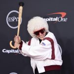 
              Maybelle Blair poses with a baseball bat cane as she arrives at the ESPY Awards on Wednesday, July 20, 2022, at the Dolby Theatre in Los Angeles. (Photo by Jordan Strauss/Invision/AP)
            