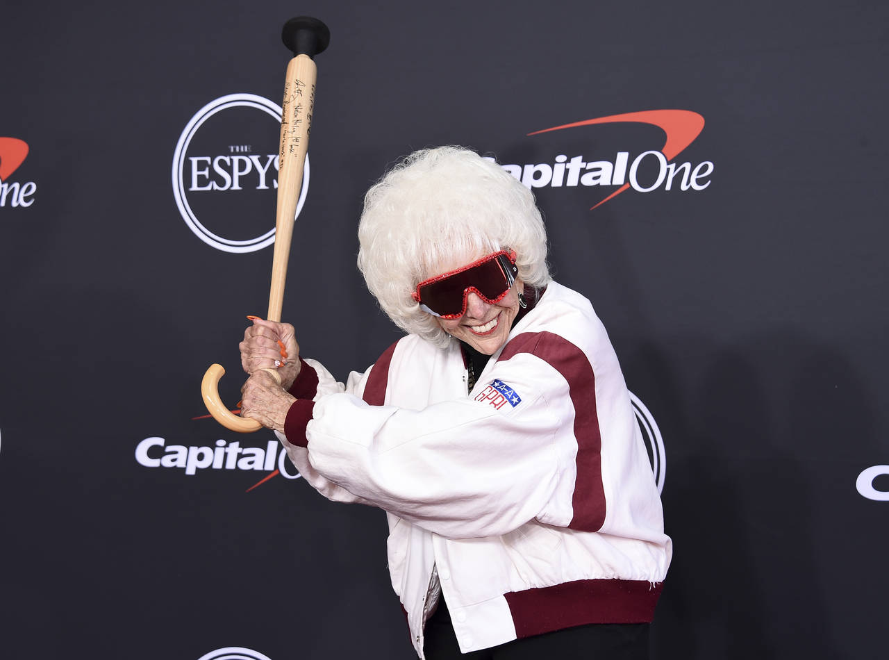 Maybelle Blair poses with a baseball bat cane as she arrives at the ESPY Awards on Wednesday, July ...