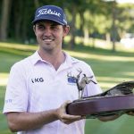
              J.T. Poston holds the trophy after winning the John Deere Classic golf tournament, Sunday, July 3, 2022, at TPC Deere Run in Silvis, Ill. (AP Photo/Charlie Neibergall)
            