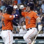 
              Houston Astros' Yordan Alverez, left, celebrates with Alex Bregman after hitting a solo home run off New York Yankees starting pitcher Domingo German during the first inning in the second game of a baseball doubleheader Thursday, July 21, 2022, in Houston. (AP Photo/Kevin M. Cox)
            