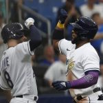 
              Tampa Bay Rays' Yandy Diaz, right, celebrates with teammate Brandon Lowe after hitting a home run against the Cleveland Guardians during the fifth inning of a baseball game Saturday, July 30, 2022, in St. Petersburg, Fla. (AP Photo/Scott Audette)
            