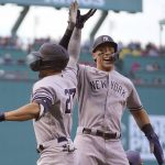 
              New York Yankees' Giancarlo Stanton, left, celebrates with Aaron Judge, right, after hitting a two run home run allowing Judge to score in the first inning of a baseball game against the Boston Red Sox, Sunday, July 10, 2022, in Boston. (AP Photo/Steven Senne)
            