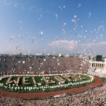 
              FILE - In this July 28, 1984 file photo, balloons are released into the air from the field of the Los Angeles Memorial Coliseum as part of the opening ceremony for the Summer Olympic Games in Los Angeles. Track is a niche sport in the United States when it comes to the fan base, even while the country hosts its first track world championships. They say that with sagging viewership totals and flat revenue across the broader Olympic world, it's critical to bring the cornerstone sport of the games back to its glory days in the U.S. before they return to Los Angeles in 2028. (AP Photo/Dave Tenenbaum, FIle)
            