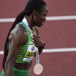 
              Tobi Amusan, of Nigeria, celebrates winning the women's 100-meter hurdles final at the World Athletics Championships on Sunday, July 24, 2022, in Eugene, Ore. (AP Photo/Gregory Bull)
            