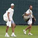 
              Spain's Rafael Nadal walks on court ahead of a practice session on day eleven of the 2022 Wimbledon Championships at the All England Lawn Tennis and Croquet Club, Wimbledon, London, Thursday July 7, 2022. (Adam Davy/PA via AP)
            
