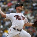 
              Minnesota Twins pitcher Dylan Bundy throws against the Chicago White Sox during the first inning of a baseball game, Saturday, July 16, 2022, in Minneapolis. (AP Photo/Craig Lassig)
            