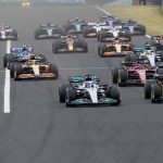 
              Mercedes driver George Russell of Britain, front left, leads at the start and followed by Ferrari driver Carlos Sainz of Spain during the Hungarian Formula One Grand Prix at the Hungaroring racetrack in Mogyorod, near Budapest, Hungary, Sunday, July 31, 2022. (AP Photo/Darko Bandic)
            