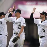 
              Colorado Rockies shortstop Jose Iglesias, center fielder Yonathan Daza and right fielder Randal Grichuk, from left, celebrate the team's win in a baseball game against the San Diego Padres on Thursday, July 14, 2022, in Denver. (AP Photo/David Zalubowski)
            