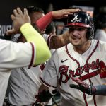 
              Atlanta Braves' Austin Riley, right, celebrates with teammates after hitting a two-run home run against the Los Angeles Angels during the fourth inning of a baseball game Saturday, July 23, 2022, in Atlanta. (AP Photo/Butch Dill)
            