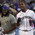 
              American League's Julio Rodriguez, of the Seattle Mariners, right, smiles next to Toronto Blue Jays' Vladimir Guerrero Jr. during the MLB All-Star baseball Home Run Derby, Monday, July 18, 2022, in Los Angeles. (AP Photo/Mark J. Terrill)
            