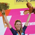 
              Netherland's Annemiek Van Vleuten, the overall leader's yellow jersey, celebrates on the podium after winning the 8th stage of the Tour de France women's cycling race from Lure to La Super Planche des Belles Filles, eastern France, Sunday, July 31, 2022. (AP Photo/Jean-Francois Badias)
            