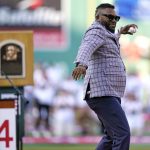 
              Newly inducted Hall of Fame designated hitter David Ortiz throws out the ceremonial first pitch while being honored prior to a baseball game between the Boston Red Sox and Cleveland Guardians at Fenway Park, Tuesday, July 26, 2022, in Boston. (AP Photo/Charles Krupa)
            