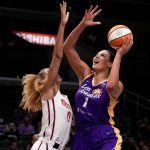 
              Los Angeles Sparks center Liz Cambage (1) drives to the basket against Washington Mystics center Shakira Austin (0) during the first half of a WNBA basketball game Tuesday, July 12, 2022, in Los Angeles. (Keith Birmingham/The Orange County Register via AP)
            