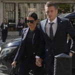 
              FILE - Leicester City and England soccer player Jamie Vardy, and his wife Rebekah Vardy, arrive together at the High Court in London, Tuesday, May 17, 2022. On Friday, July 29, 2022, Judge Karen Steyn has cleared Coleen Rooney of libeling Vardy when she alleged that Vardy had leaked her private social media posts to the tabloid press. (AP Photo/Alastair Grant, File)
            