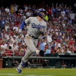 
              Los Angeles Dodgers' Gavin Lux rounds the bases after hitting a two-run home run during the seventh inning of a baseball game St. Louis Cardinals Thursday, July 14, 2022, in St. Louis. (AP Photo/Jeff Roberson)
            