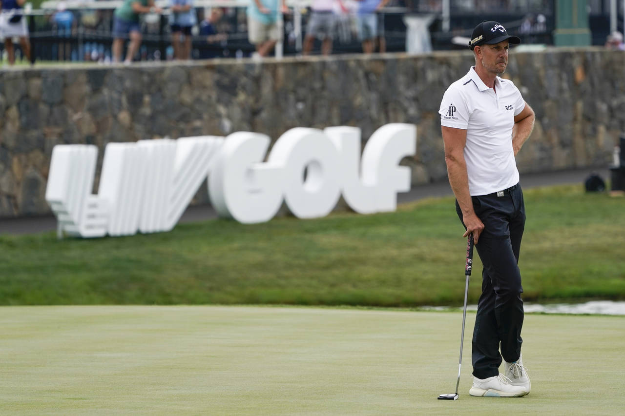 Henrik Stenson watches play on the 18th hole during the first round of the Bedminster Invitational ...