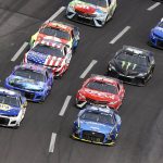
              NASCAR Cup Series drivers Chase Elliott (9), left, and Ryan Blaney (12), right, lead the field out of Turn 4 during the NASCAR Cup Series auto race at Atlanta Motor Speedway, Sunday, July 10, 2022, in Hampton, Ga. (AP Photo/John Bazemore)
            