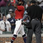 
              Atlanta Braves' Michael Harris II celebrates his two-run home run during the eighth inning of a baseball game against the Washington Nationals on Friday, July 8, 2022, in Atlanta. (AP Photo/Ben Margot)
            