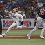 
              Tampa Bay Rays' Taylor Walls, second from left, runs through third base during the sixth inning of a baseball game against the Boston Red Sox, Monday, July 11, 2022, in St. Petersburg, Fla. (AP Photo/Scott Audette)
            