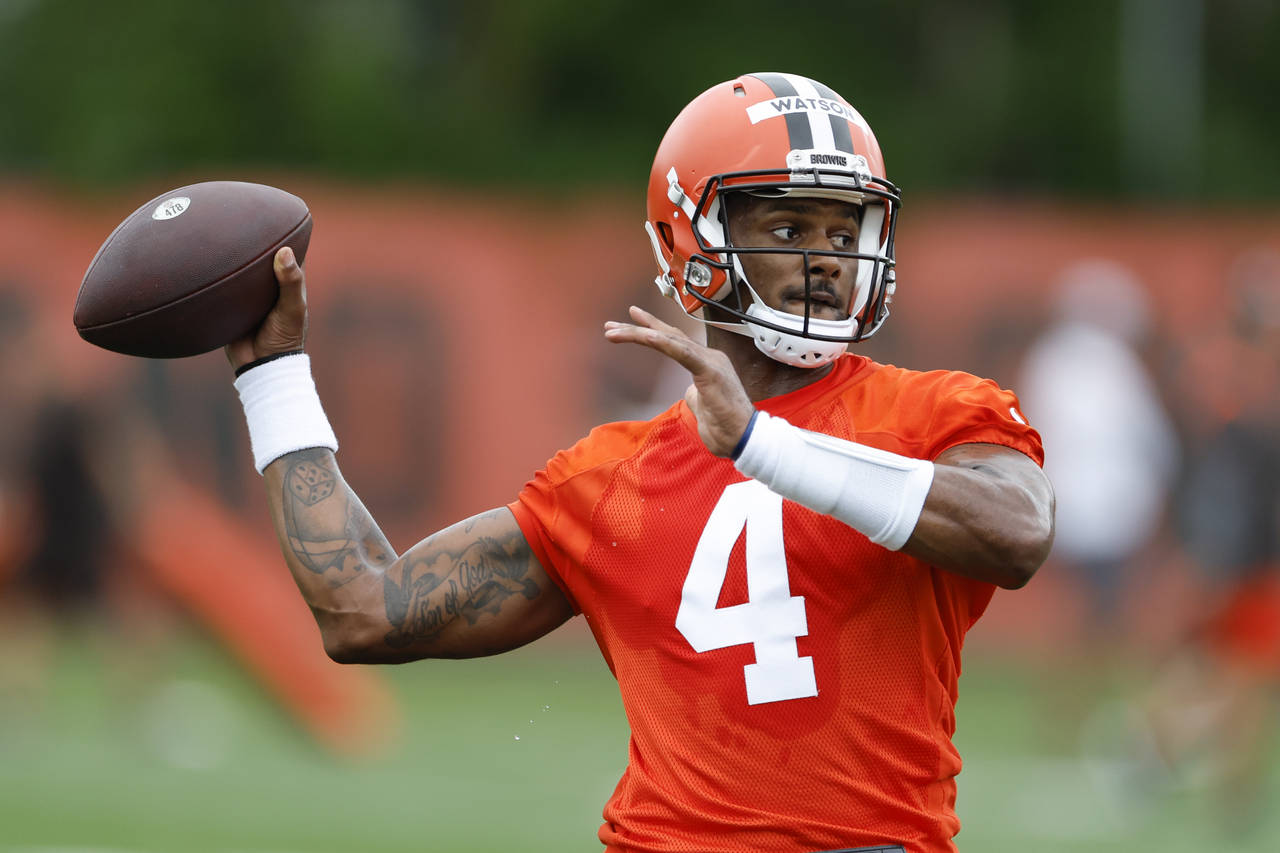 FILE - Cleveland Browns quarterback Deshaun Watson takes part in drills at the NFL football team's ...