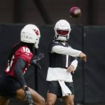 
              Arizona Cardinals quarterback Kyler Murray (1) throws a pass to wide receiver DeAndre Hopkins (10) as they take part in drills during the NFL football team's training camp at State Farm Stadium, Wednesday, July 27, 2022, in Glendale, Ariz. (AP Photo/Ross D. Franklin)
            