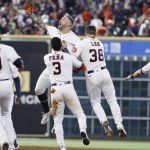 
              Houston Astros pinch hitter J.J. Matijevic, center top, celebrates with Jeremy Pena (3) and Korey Lee (38) after hitting a walkoff single during the ninth inning in the first game of a baseball doubleheader against the New York Yankees, Thursday, July 21, 2022, in Houston. (AP Photo/Kevin M. Cox)
            