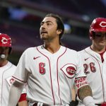 
              Cincinnati Reds' Jonathan India (6) walks off the field with Matt Reynolds (4) and Michael Papierski (26) after hitting a grand slam during the fifth inning of a baseball game against the Miami Marlins, Monday, July 25, 2022, in Cincinnati. (AP Photo/Jeff Dean)
            