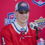 
              Juraj Slafkovsky smiles during a news conference after being selected as the first overall pick by the Montreal Canadiens during the NHL hockey draft in Montreal on Thursday, July 7, 2022. (Ryan Remiorz/The Canadian Press via AP)
            