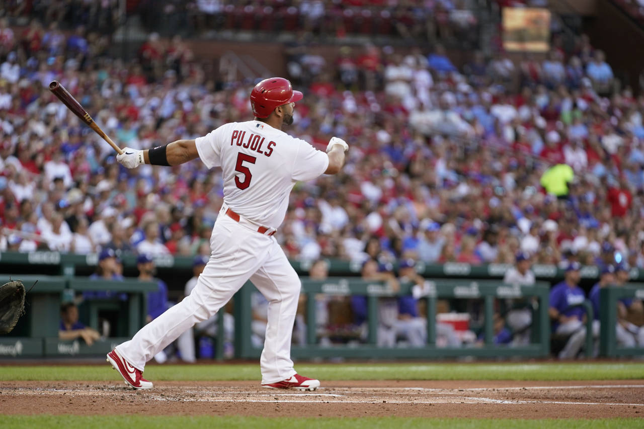 St. Louis Cardinals' Albert Pujols watches his solo home run' during the second inning of a basebal...