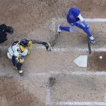 
              Chicago Cubs' P.J. Higgins hits an RBI double during the ninth inning of a baseball game against the Milwaukee Brewers Wednesday, July 6, 2022, in Milwaukee. (AP Photo/Morry Gash)
            