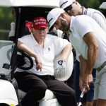 
              Former President Donald Trump sits in a golf cart as he watches Dustin Johnson putt during the pro-am round of the Bedminster Invitational LIV Golf tournament in Bedminster, N.J., Thursday, July 28, 2022. (AP Photo/Seth Wenig)
            