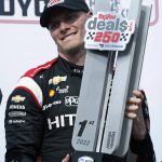 
              Josef Newgarden holds the trophy after winning the IndyCar Series auto race Saturday, July 23, 2022, at Iowa Speedway in Newton, Iowa. (AP Photo/Charlie Neibergall)
            