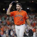 
              Houston Astros starting pitcher Justin Verlander (35) tips his cap to the crowd after being removed during the eighth inning of the team's baseball game against the Seattle Mariners on Friday, July 29, 2022, in Houston. (AP Photo/Michael Wyke)
            