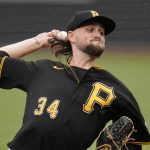 
              Pittsburgh Pirates starting pitcher JT Brubaker delivers during the first inning of a baseball game against the Philadelphia Phillies in Pittsburgh, Sunday, July 31, 2022. (AP Photo/Gene J. Puskar)
            
