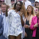 
              Venus Williams takes a photo standing between U.S. tennis legend Billie Jean King and Rod Laver during a 100 years of Centre Court celebration on day seven of the Wimbledon tennis championships in London, Sunday, July 3, 2022. (AP Photo/Kirsty Wigglesworth)
            
