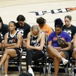 
              Phoenix Mercury players bow their heads in prayer at a rally for WNBA basketball teammate Brittney Griner Wednesday, July 6, 2022, in Phoenix. Griner has been detained in Russia for 133 days, charged in Russia for having vape cartridges containing hashish oil in her luggage. (AP Photo/Ross D. Franklin)
            