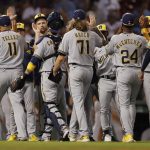 
              The Milwaukee Brewers celebrate after defeating the Boston Red Sox during a baseball game, Friday, July 29, 2022, in Boston. (AP Photo/Michael Dwyer)
            