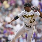 
              Pittsburgh Pirates relief pitcher Yerry De Los Santos works against the Colorado Rockies during the seventh inning of a baseball game Saturday, July 16, 2022, in Denver. (AP Photo/David Zalubowski)
            