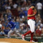 
              Boston Red Sox's Darwinzon Hernandez walks off the mound after giving up a two-run home run to Toronto Blue Jays' Danny Jansen, rear, during the sixth inning of a baseball game Friday, July 22, 2022, in Boston. (AP Photo/Michael Dwyer)
            