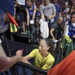 
              Seattle Storm guard Sue Bird signs autographs before the WNBA basketball game between the Connecticut Sun and the Storm, Thursday, July 28, 2022, in Uncasville, Conn. (AP Photo/Bryan Woolston)
            