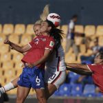 
              Costa Rica's Carol Sanchez (6) and United States' Lindsey Horan (10) fight for the ball during a CONCACAF Women's Championship soccer semifinal match in Monterrey, Mexico, Thursday, July 14, 2022. (AP Photo/Fernando Llano)
            