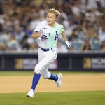 
              Jojo Siwa gestures runs the bases during the MLB All Star Celebrity Softball game, Saturday, July 16, 2022, in Los Angeles. (AP Photo/Abbie Parr)
            