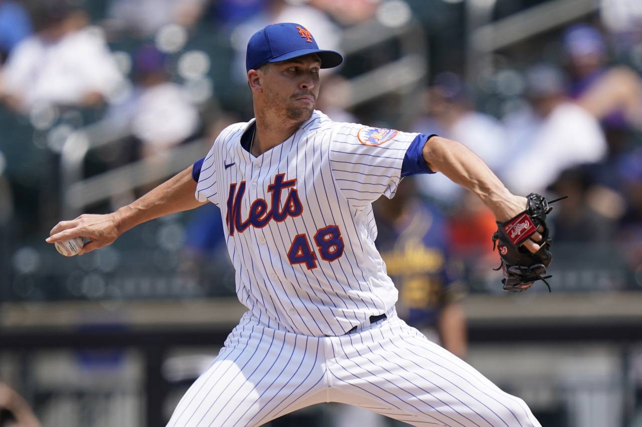 FILE - New York Mets' Jacob deGrom delivers a pitch during the first inning of the first baseball g...