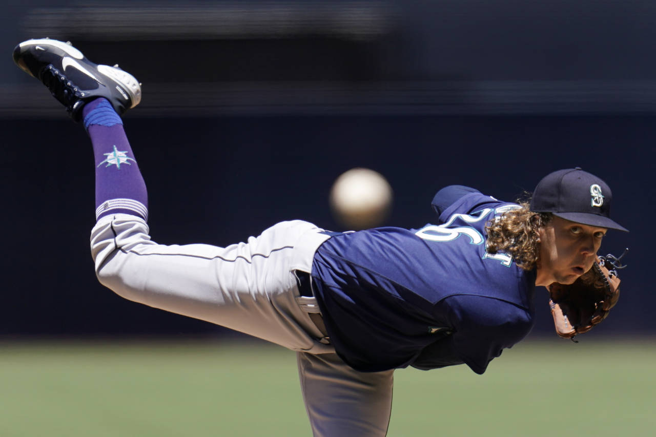 Seattle Mariners starting pitcher Logan Gilbert works against a San Diego Padres batter during the ...